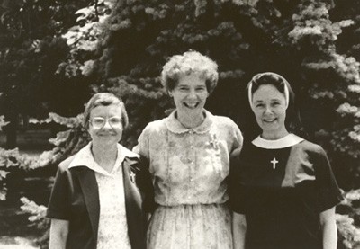 black and white photo of three sisters in the 1980s