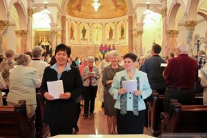 Sisters Dina Bato and Regina Gallo are all smiles as they process out at the end of Mass.