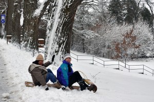 Sisters Evelyn Ovalles and Mary Montgomery getting ready to sled down the hill at Saint Mary-of-the-Woods
