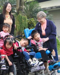 Sister Ruth Sampson works with children at St. Therese Opportunity Center in Taiwan in 2004