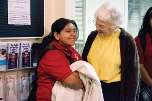 Sister Patty Fillenwarth chats with a student from the afterschool homework club at Providence Family Services in Chicago where Sister Patty ministers as both the director and a counselor.