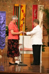 Sister Patty Wallace, right, receives from General Superior Sister Denise Wilkinson, left, a ring signifying her lifelong vows with the Sisters of Providence of Saint Mary-of-the-Woods, which she professed during a vow ceremony June 30 at Saint Mary-of-the-Woods.