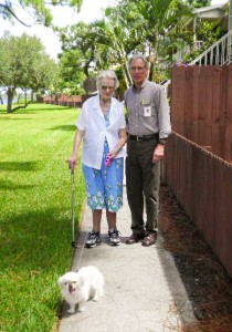 Sister Margaret Louise and her therapist, Eric, take Abby for a short walk.