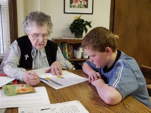 Sister Frances Joan Baker volunteers tutoring a student after school in 2005 at Educational/Family Services, an SP ministry that provides free tutoring to those in the West Terre Haute area.