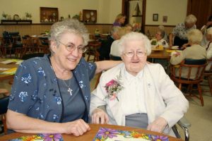 Sister Mary Eymard Campeggio, right, attends the SP over 90s party in 2006 with her guest Sister Maria Smith.