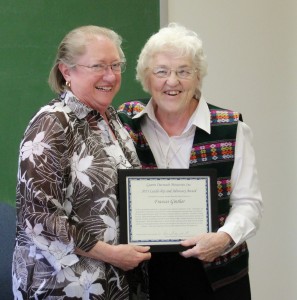 Sister Patty Fillenwarth, right, presents the Guerin Outreach Ministries Leadership and Advocacy Award for 2013 to Frances Ginther, left.