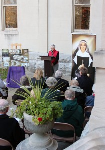 Sister Denise Wilkinson, general superior of the Sisters of Providence, leads prayer during a construction blessing marking the beginning of work on a new shrine for Saint Mother Theodore Guerin at Saint Mary-of-the-Woods. The new shrine will be located just beyond the right window in this photo, down the hall from the Church of the Immaculate Conception.