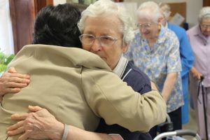 Sister Ann Francis Hammersley congratulates Sister Dina Bato on her entrance to the novitiate in 2009.