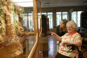 Sister Eileen Clare Goetzen admiring the aviary at Providence Health Care with Mandy.