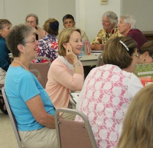 Blog post author and Providence Associate Susan Weber, center, chat with those at her table during a Saturday meeting of the Providence Associate annual meeting. To her left is Mary Carroll Blocher.