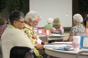 Providence Associates Barbara Cottrell and Bill Adams pause for prayer during a gathering of Providence Associates.