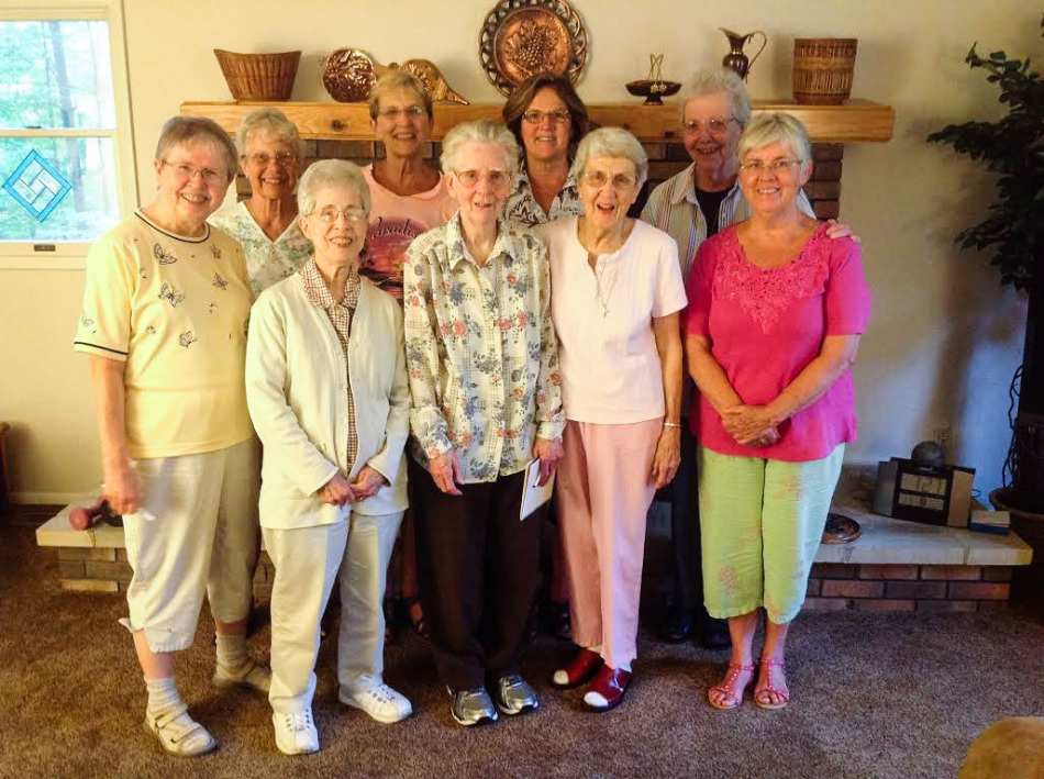 Rosaline Secrest (pink shirt, back row) with her Pax Christi group of Sisters of Providence, Providence Associates and friends.