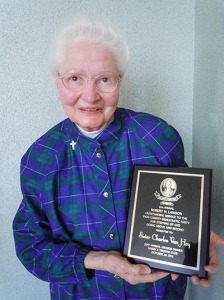 Sister Charles Van Hoy with the award she recently received from the Vigo County Democratic Party.