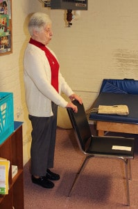 Sister Kathryn Koressel leads a stretching class in the basement of Providence Hall.