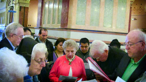 Sister Marilyn Kofler, center, joins Sisters and Brothers of Immigrants in a prayer service in the rotunda at the Illinois Capitol in Springfield in an effort to lobby for temporary driving licenses for new immigrants. (Submitted photo.)
