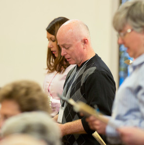 Providence Associate Duane Drake, center, during the ceremony last November where he made his first commitment as a Providence Associate.