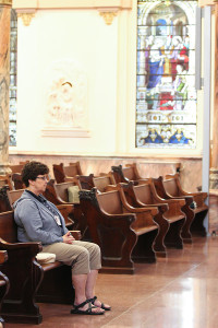 Sister Carole Kimes in quiet prayer in the Church of the Immaculate Conception at Saint Mary-of-the-Woods, Indiana.