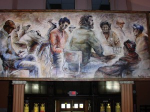 This mural by artist Mary Cobb hangs over the welcome desk at the men’s homeless shelter in Louisville, Kentucky, where Providence Associate Maria Price serves as executive director. 