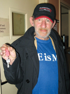Roy, a shelter client, shows the keys to his apartment after nearly 10 years of being homeless. 