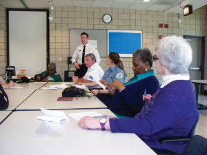 In a meeting with police and other community volunteers.
