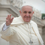 Pope Francis smiling and waving