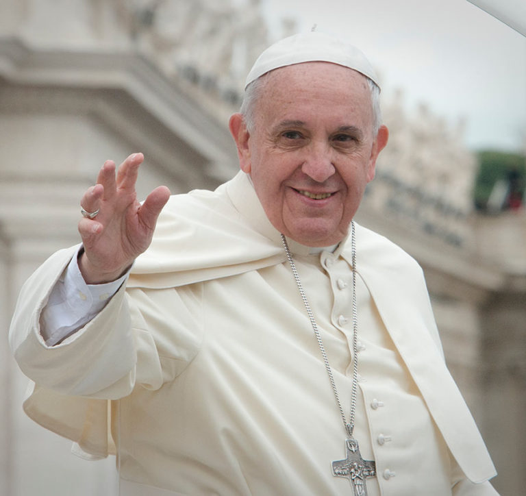 Pope Francis smiling and waving