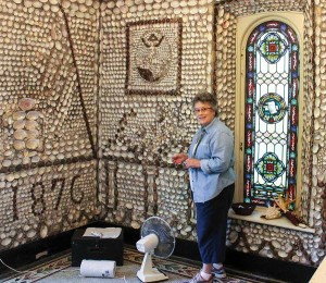 Connie Schnapf reglues loose shells in the St. Anne Shell Chapel while volunteering at Saint Mary-of-the-Woods.