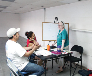 Sister Loretta, at right, teaches English to adult students in Thermal, California, as part of her ministry with Providence in the Desert.