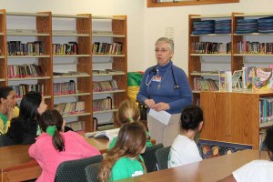 Sister Barbara Battista meeting with students at St. Patrick School.