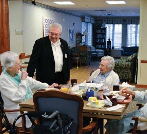 Father Dan Hopcus, a Providence Associate and chaplain for the Sisters of Providence at Saint Mary-of-the-Woods, enjoys his daily visits to sisters and other residents at Providence Health Care. Here, Father Dan visits with Sister Anne Krause (formerly Sister Marie Robert) and Mary Imelda Coulap.