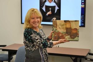 Dr. Dottie King displays her gift from the Sisters of Providence.