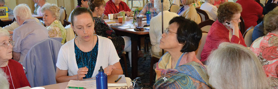 Doing the work of Chapter: Sisters Tracey Horan and Editha Ben discuss justice issues. 