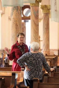 Sister Dawn speaks with an associate before the ceremony.