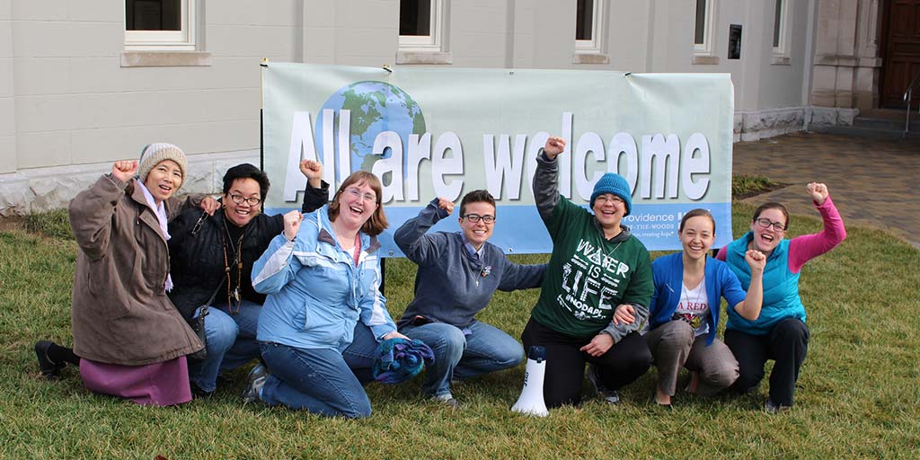 Bronze statue of Mother Theodore teaching two young girls