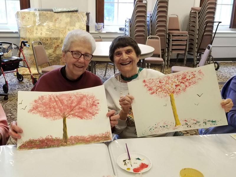 Sisters painting with Mike Sanders