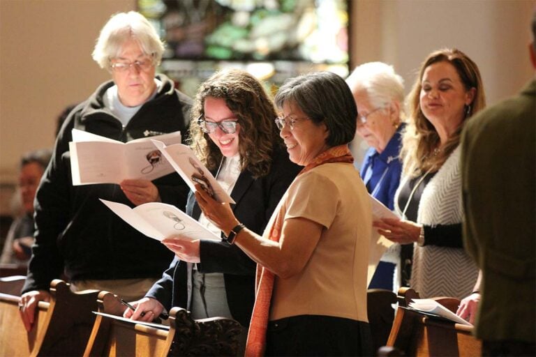 Associates and sisters participating in a service.