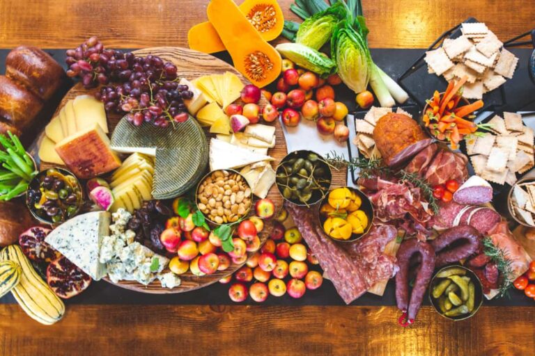 Charcuterie board with cheeses, fruits, and meats