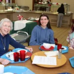 (Above) Sister Rosemary Smaltz enjoying lunch with DePaul University junior Isabella White.