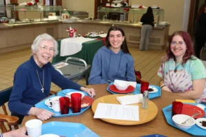 (Above) Sister Rosemary Smaltz enjoying lunch with DePaul University junior Isabella White.