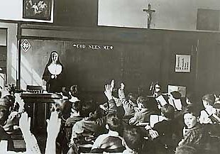 In the mid 1940s, Sister Mary Louise Hafferty gets an eager response from her students at St. Rose School in Chelsea, Mass.