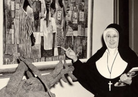 Sister Esther Newport, a native of Terre Haute, with one of her paintings.