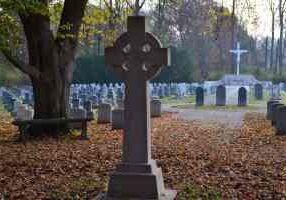 Several Sisters of Providence and others conduct an All Souls Day ceremony at the Congregation Cemetery