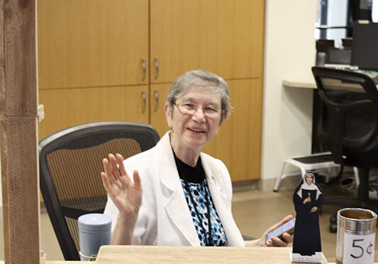Sister Marilyn Baker ready to offer advice at the "Sister Is In" station.