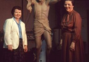 Sisters of Providence leadership members at the time, Sisters Nancy Nolan and Ann Casper, with the new statue before it was mounted on the cross