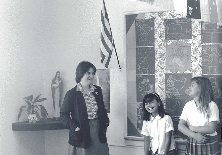 Sister Anne Therese Falkenstein, who currently ministers as a General Officer, began her teaching career at Saint Anthony of Padua in Gardena, California, where she ministered from 1982-87. Here she is photographed with students at the school.