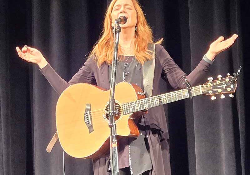 Carrie Newcomer performing.