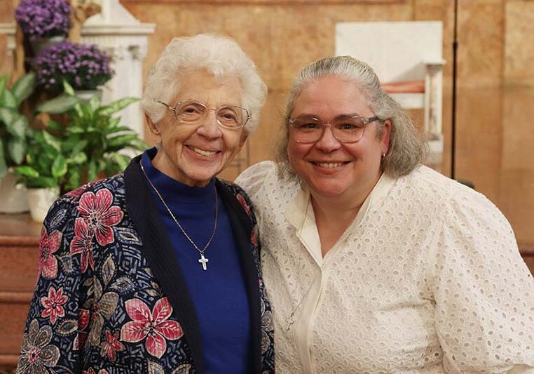 Sister Marilu Covani (left) smiling with Sister Maité Rodriguez-Mora.