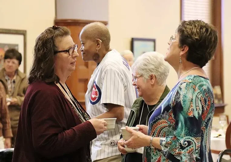 Providence Associates (from left) Cami Pritchett and Lorrie Scheidler chatting.
