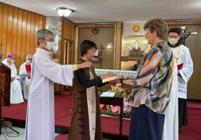 Sister Anna Fan professes vows with General Superior Sister Dawn Tomaszewski.