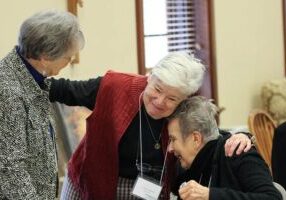 Sister Rosemary Nudd greets candidate Sandra Chappell and her companion Providence Associate Mickie Lane Fredericks